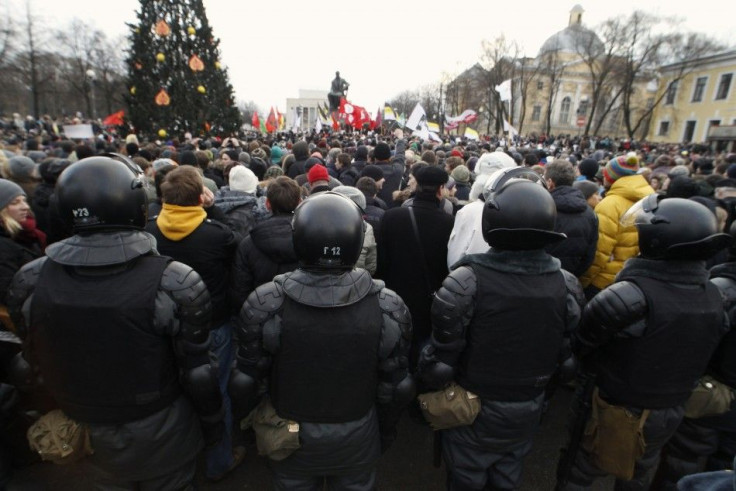 Riot police stand guard a rally to protest against what activists say were violations at the parliamentary elections, in St. Petersburg December 10, 2011.