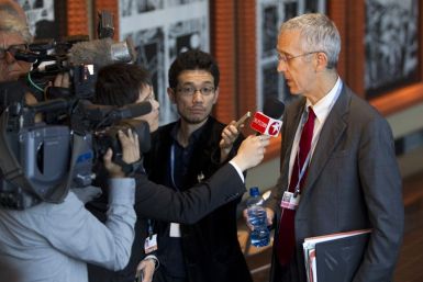 U.S. chief climate envoy Todd Stern, right, is interviewed by television crews after an agreement was reached to extend the Kyoto Protocol at the United Nations Climate Change Conference (COP17) in Durban December 11, 2011.