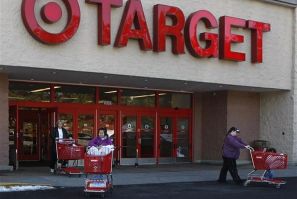 Shoppers exit a Target store with their purchases in Fairfax