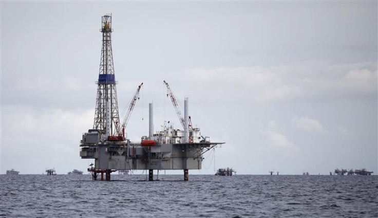 A view of a drilling rig and distant production platform in the Soldado Field off Trinidad&#039;s southwest coast