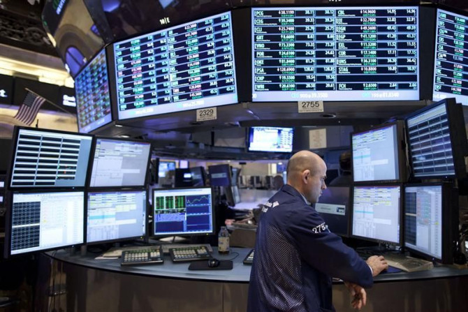 A trader works on the floor of the New York Stock Exchange in New York