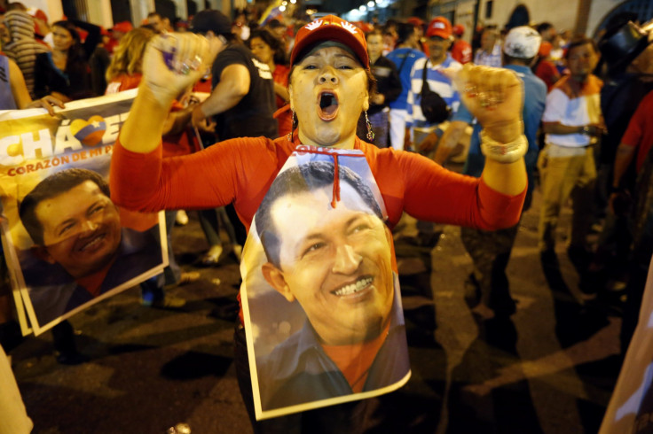 Supporters of Venezuelan President Hugo Chavez gather outside the Miraflores Palace in Caracas to wait for the results of the presidential election on Sunday.