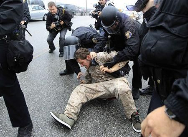 Police arrest a protester during the Occupy movements&#039; attempt to shut down west coast ports in Long Beach, California