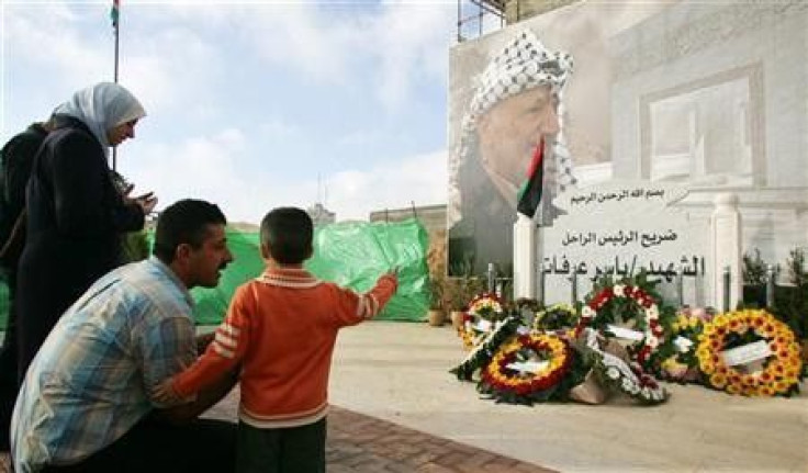 Palestinians visit the grave of late Palestinian leader Yasser Arafat in Ramallah