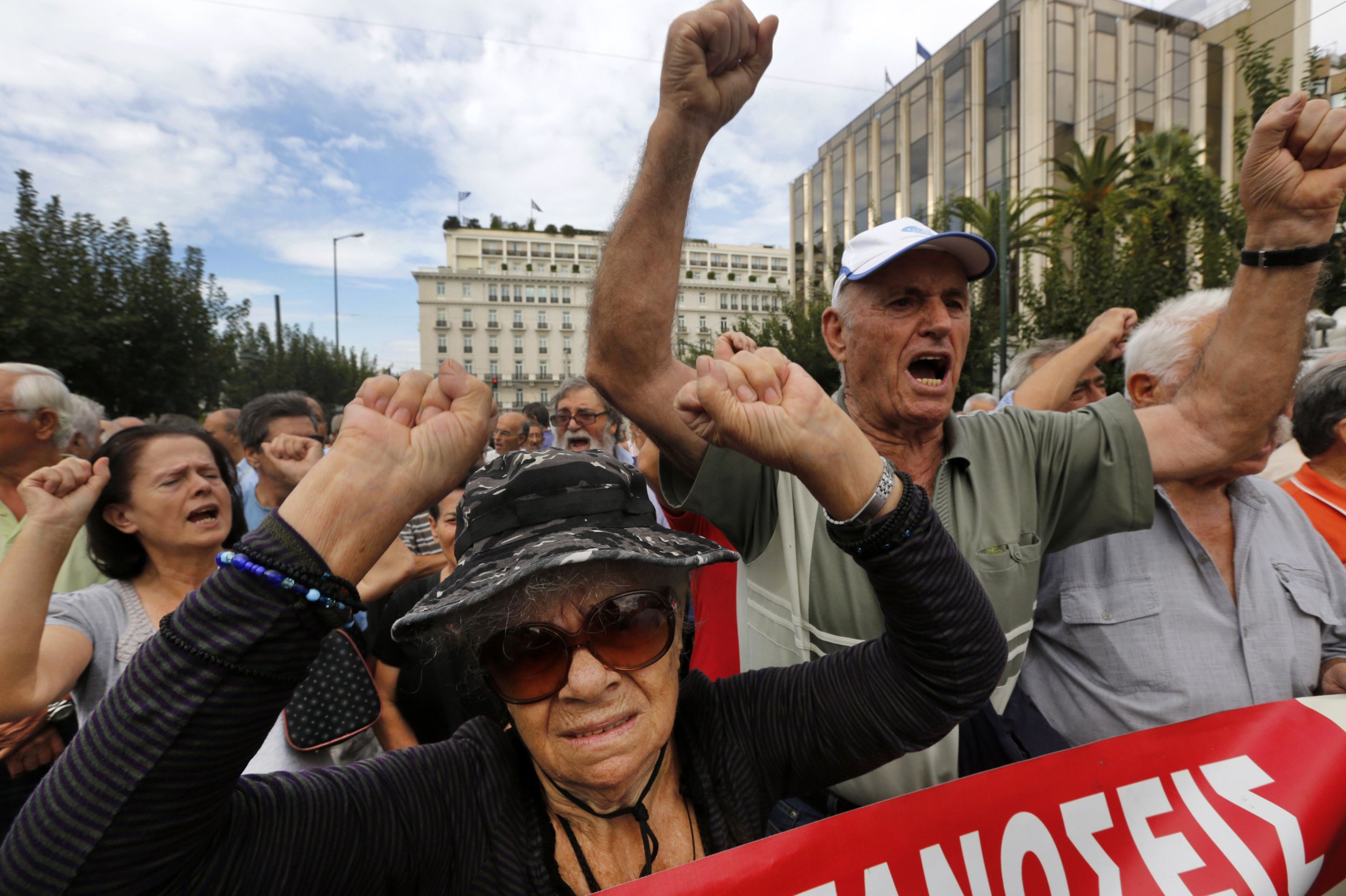 Retirees chant during a march against austerity measures in Athens on October 8.