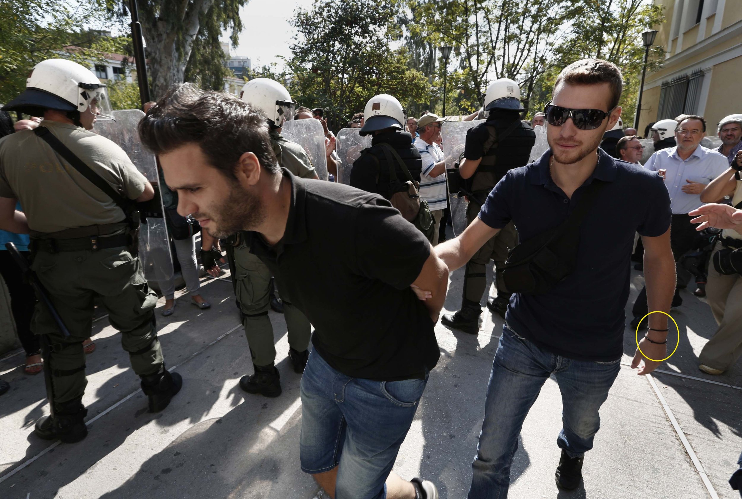 A striking shipyard worker is arrested by a plainclothes policeman during demonstrations on October 5.