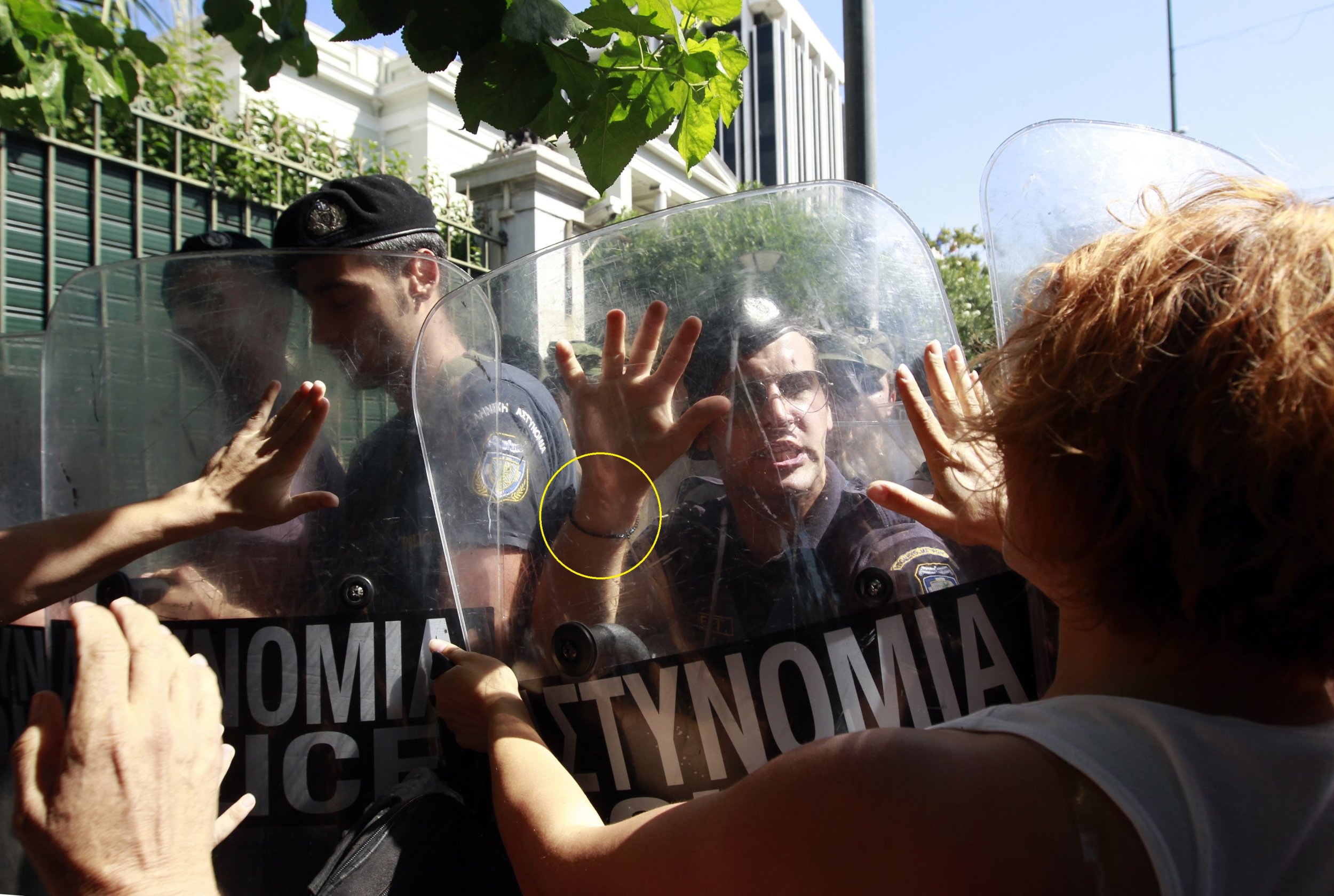 Demonstrators attempt to break through a police cordon during a protest against cuts to services for people with disabilities on September 27.