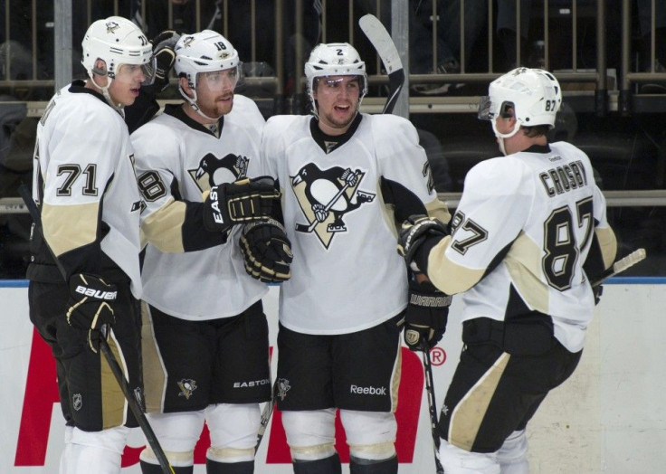 Pittsburgh Penguins Malkin, Niskanen and Crosby congratulate Neal after he scored against Rangers in New York