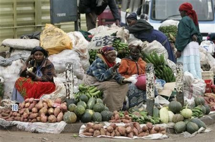 Women sell vegetables and fruits on the roadside in Nairobi, Kenya