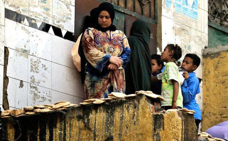 Egyptian people wait for bread during Morsi's first 100 days Oct. 4, 2012