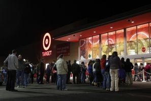 Shoppers stand outside of a Target store at midnight on &quot;Black Friday&quot; as they wait for those who stood in line to enter the store first in Torrington