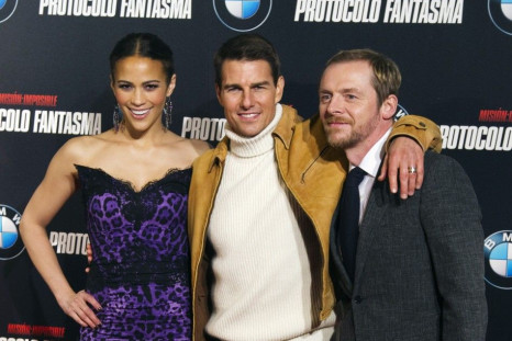U.S. actor Tom Cruise (C) poses with cast members Paula Patton and Simon Pegg (R) during a photocall to promote their latest film &quot;Mission Impossible: Ghost Protocol&quot; in central Madrid