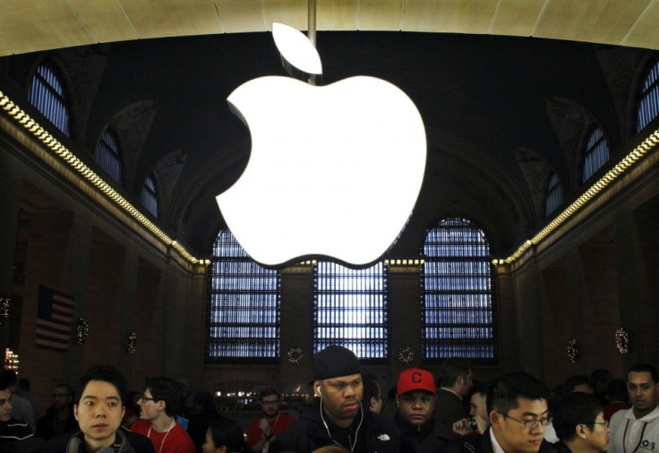 Customers buy Apple products inside the newest Apple Store during its opening on the East Balcony in the main lobby of New York City's Grand Central Station