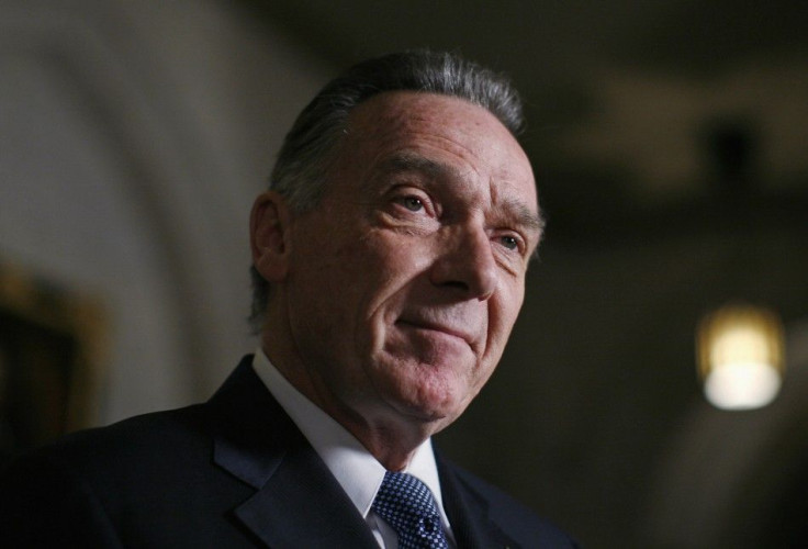 Canada&#039;s Environment Minister Peter Kent pauses while announcing that Canada will formally withdraw from the Kyoto protocol on climate change, in Ottawa