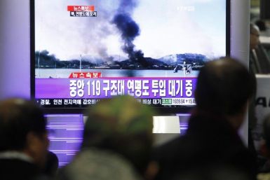 South Koreans watch news on television