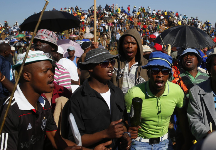 After being evicted from the mine they were seizing Tuesday, striking miners gathered on a hill near the site in the Johannesburg suburb of Carltonville.