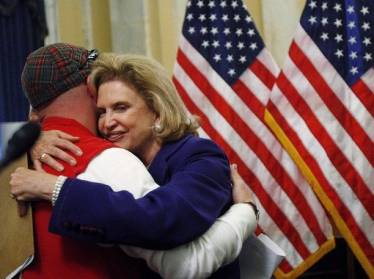 U.S. Rep. Carolyn Maloney (D-NY) hugs First Responder John Feal after the introduction of the James Zadroga 9/11 Health and Compensation Act on Capitol Hill in Washington, June 24, 2009.