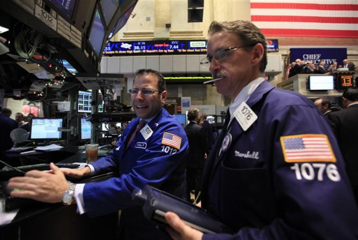 Specialist trader Mike Pistillo and Marshall Ryan work on the floor of the New York Stock Exchange