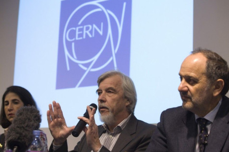 Heuer, CERN Director General, gestures next to Gianotti, ATLAS experiment spokesperson, and Tonelli, CMS experiment spokesperson, during news conference at CERN in Meyrin