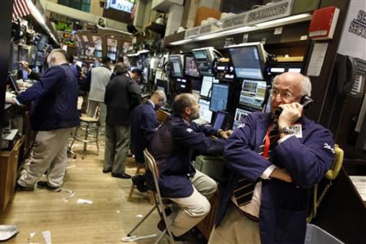 Traders work on the floor of the New York Stock Exchange