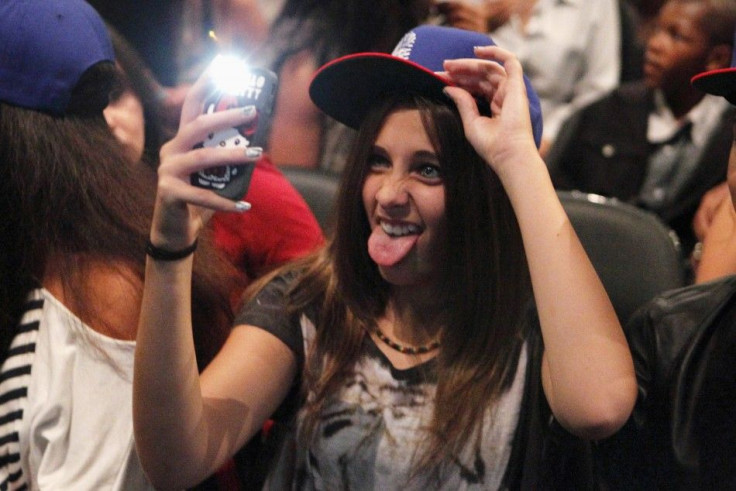 Paris Michael Katherine Jackson, daughter of late singer Michael Jackson, takes a photo before R&B artist Chris Brown performs in Los Angeles