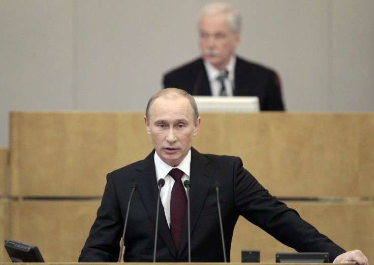 Russia&#039;s Prime Minister Vladimir Putin addresses the parliament, with Parliament Speaker and Chairman of the United Russia political party council Boris Gryzlov in the background, at Russian State Duma in Moscow