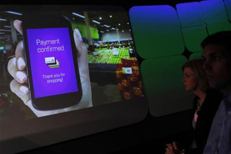 Attendees watch a demonstration of the Google wallet application screen during a news conference unveiling the mobile payment system in New York