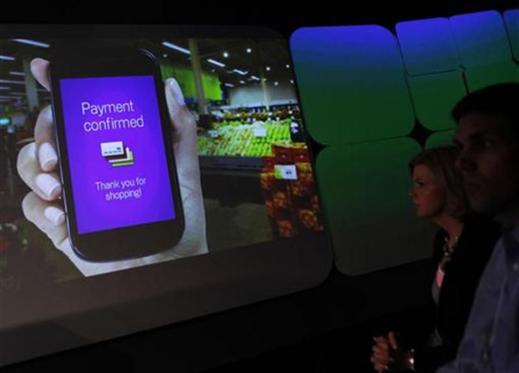 Attendees watch a demonstration of the Google wallet application screen during a news conference unveiling the mobile payment system in New York
