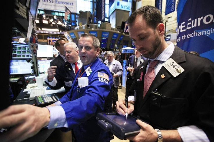 Traders work on the floor of the New York Stock Exchange