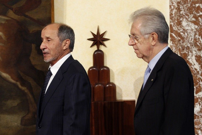 Italy&#039;s PM Monti and Libya&#039;s NTC Chairman Jalil arrive to attend a news conference in Rome
