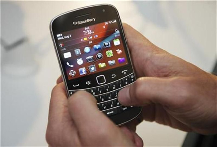 A person uses the new Blackberry Bold 9900 at a release party to promote the BlackBerry OS 7 devices made by RIM in Toronto