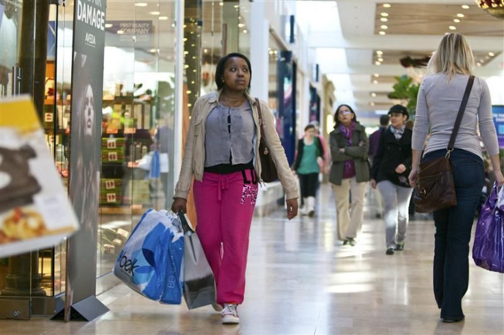 A woman carries shopping bags at South Park mall in Charlotte