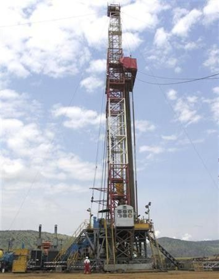 An oil rig prepares to drill in western Uganda, near the shores of Lake Albert