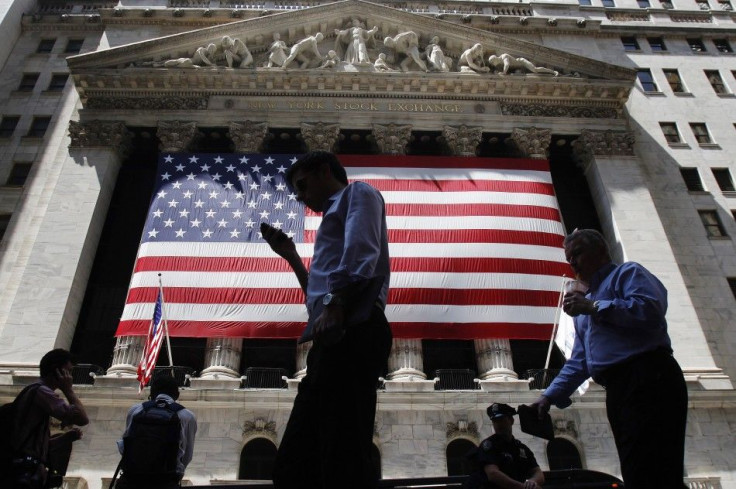 People walk outside the New York Stock Exchange in New York. (REUTERS/Shannon Stapleton)