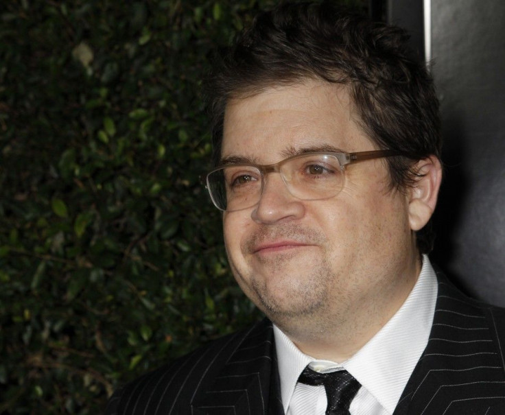 Cast member Patton Oswalt poses at the premiere of the film "Young Adult" in Beverly Hills, California