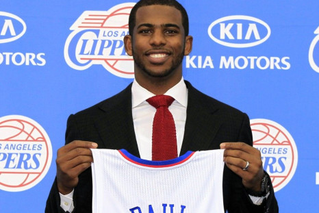 Los Angeles Clippers point guard Chris Paul poses with his new jersey after an introductory news conference in Playa Vista, Los Angeles, California 
