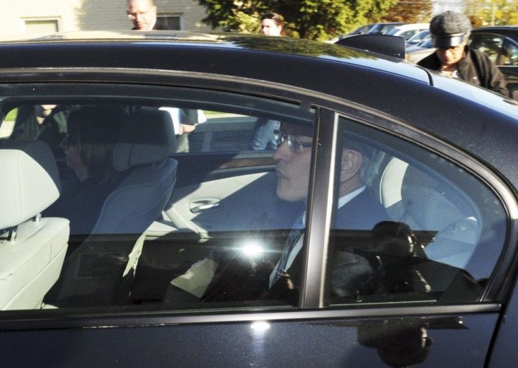 Former Penn State athletic director Tim Curley rides in the back seat of Gary Schultz's car after their arraignment on perjury charges in Harrisburg, Pa., on Nov. 7.
