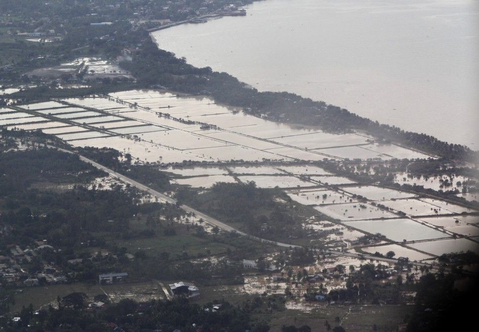 An aerial view shows villages inundated in floodwaters caused by typhoon Washi in Cagayan de Oro, southern Philippines 