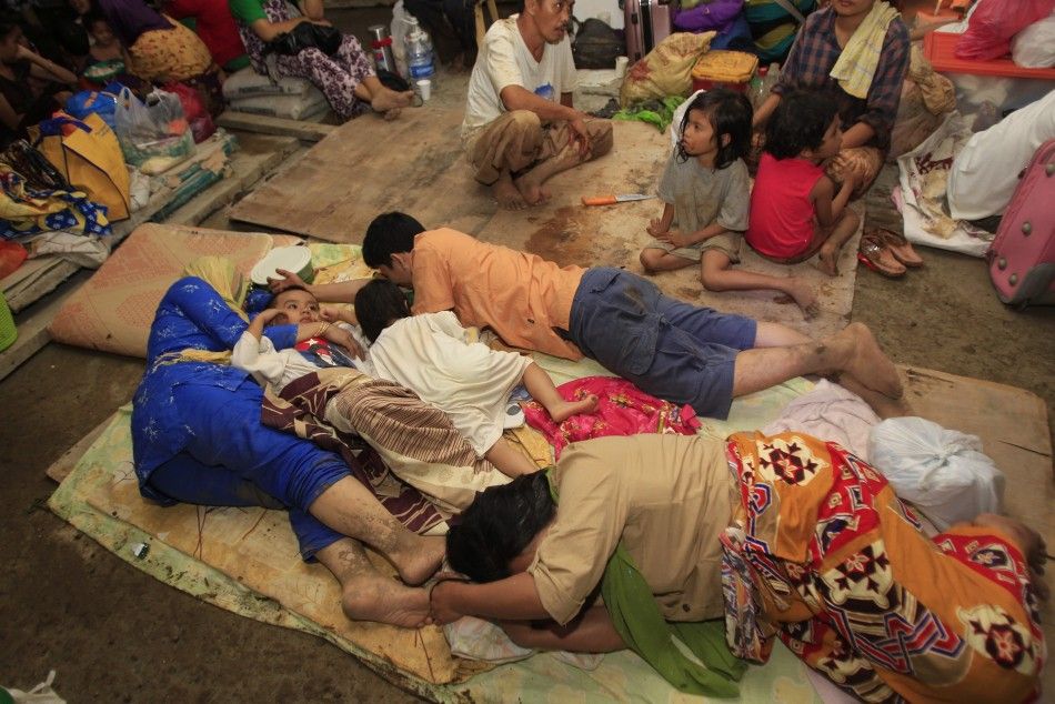 Residents rest in an evacuation centre after their houses were washed away by flashfloods caused by typhoon Washi in Cagayan de Oro, southern Philippines 