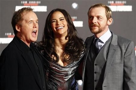 Director Brad Bird and cast members Paula Patton and Simon Pegg (R) pose on the red carpet during the European premiere of the movie ''Mission Impossible: Ghost Protocol''(Phantom Protokoll) in Munich