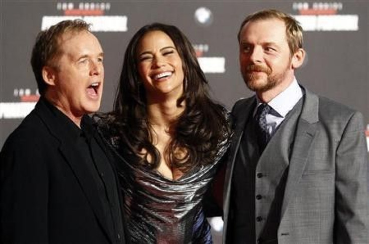 Director Brad Bird and cast members Paula Patton and Simon Pegg (R) pose on the red carpet during the European premiere of the movie &#039;&#039;Mission Impossible: Ghost Protocol&#039;&#039;(Phantom Protokoll) in Munich