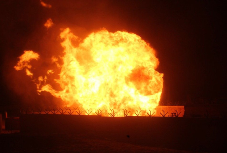 Flames rise from an Egyptian pipeline distribution station after an attack in the Sinai peninsula on July 12 2011