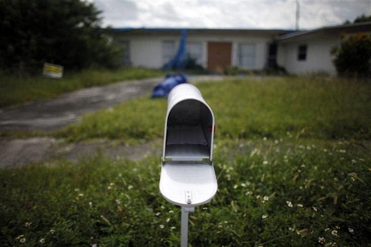 An empty mail box is seen at the front door of a foreclosed house in Miami Gardens, Florida in this September 15, 2009 file photo.