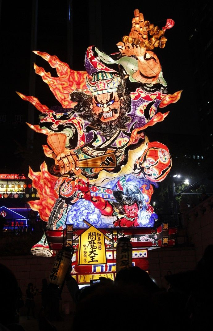 People look at a huge Japanese lantern during the Seoul Lantern Festival at the Cheonggye stream in Seoul