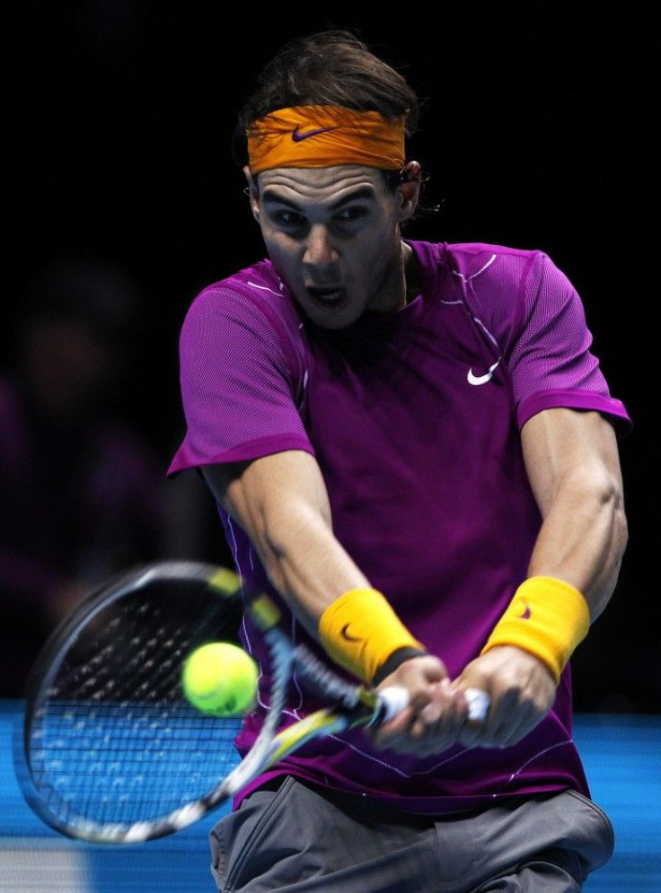 Spain's Nadal returns the ball to Serbia's Djokovic in their singles match at the ATP World Tour Finals in London.