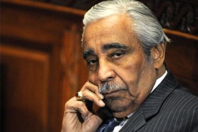 U.S. Representative Charles Rangel (D-NY) talks on his mobile phone as he waits for the panel to return from a break in his ethics hearing before the House Adjudicatory subcommittee at Capitol Hill in Washington, November 18, 2010