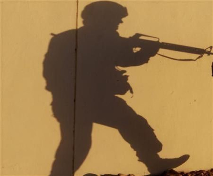 The shadow of a U.S. soldier from 2nd Brigade Special Troops Battalion