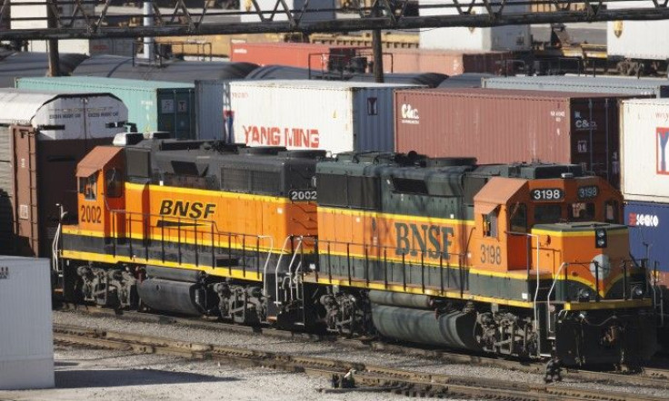 Burlington Northern Santa Fe trains make their way through a rail yard in Cicero Illinois