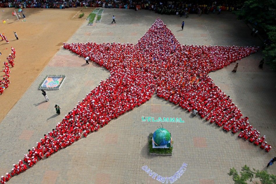 Schoolchildren dressed as Santa Claus form the shape of a star ahead of Christmas celebrations at a school in the southern Indian city of Chennai December 10, 2011. Some 1500 schoolchildren aged three to five formed the shape of a Christmas star on Saturd