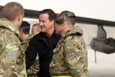 Britain&#039;s Prime Minister David Cameron is introduced to British soldiers at Kandahar airfield during a visit to British forces in Afghanistan